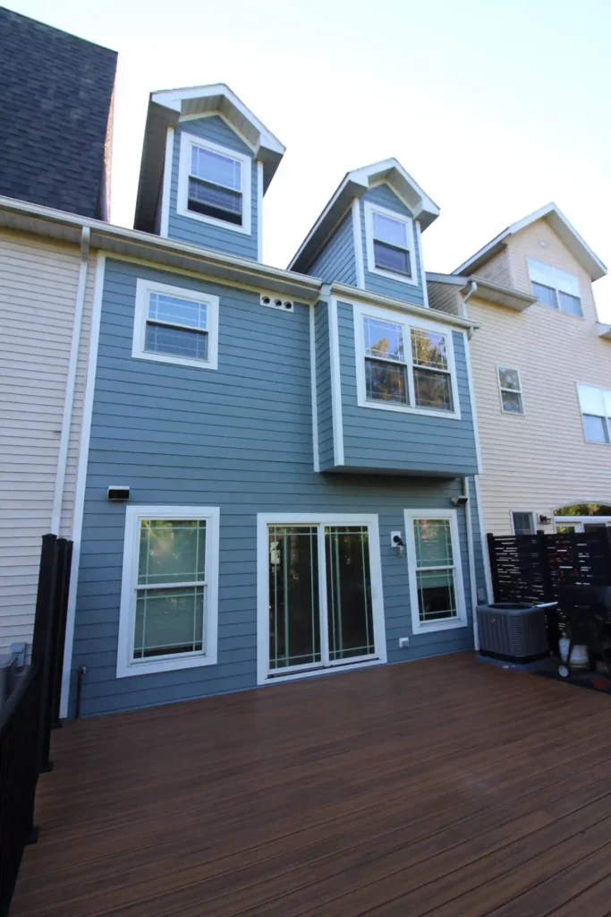 alternate view of townhome with brand new blue james hardie siding showing exterior armors excellent work
