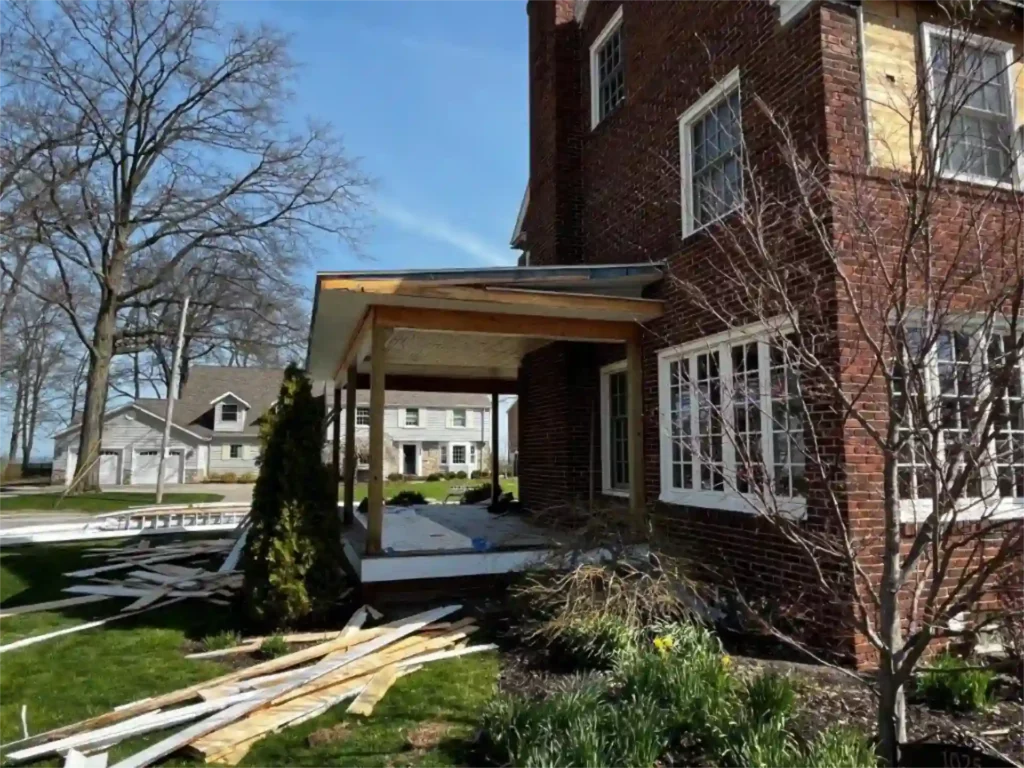 image of a new front porch under construction with building materials in the yard