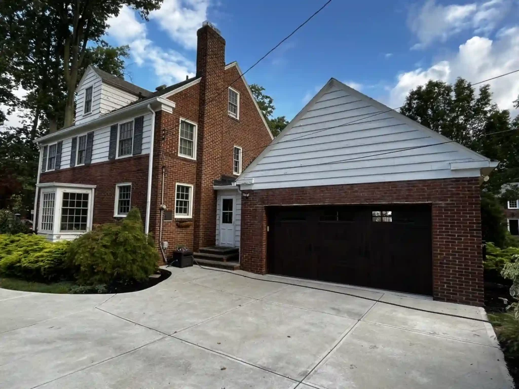 side view of house with old worn out siding