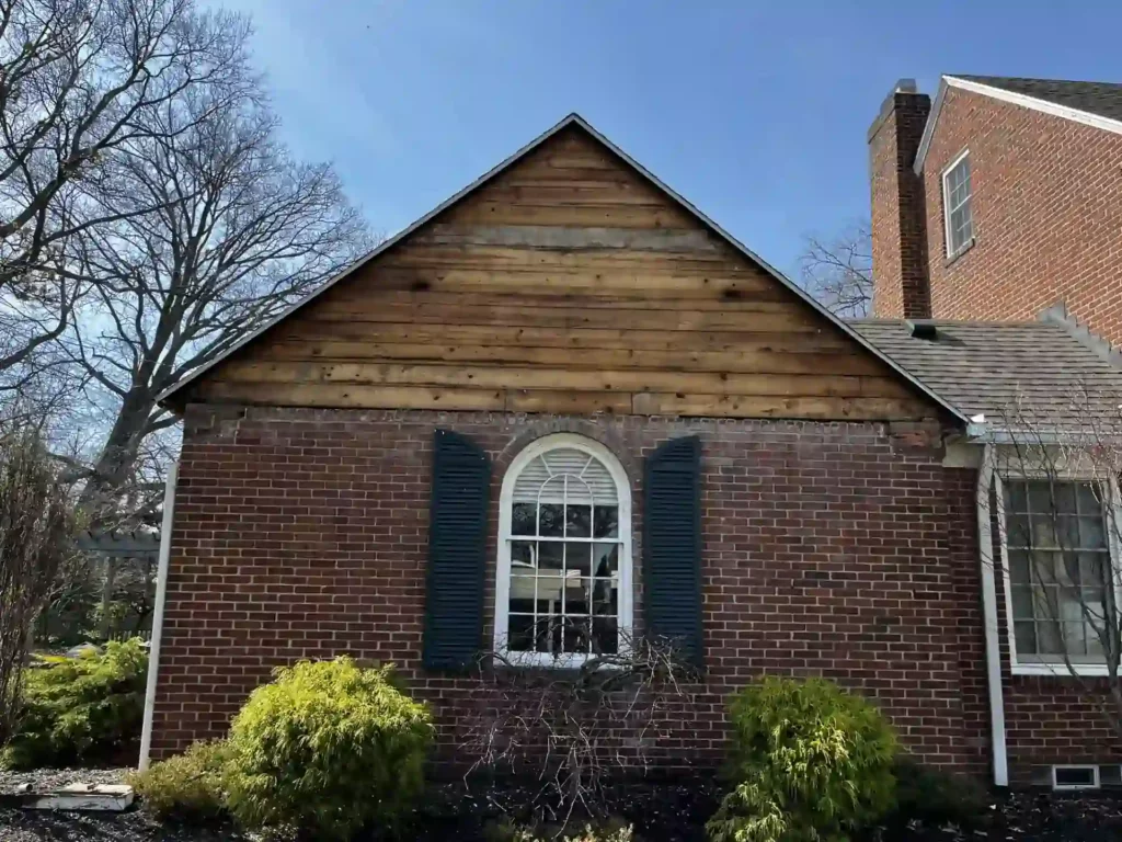 job site of home getting new vinyl siding wood panel exposed