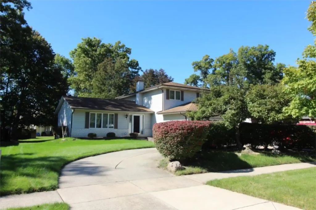front elevation of home with circle drive